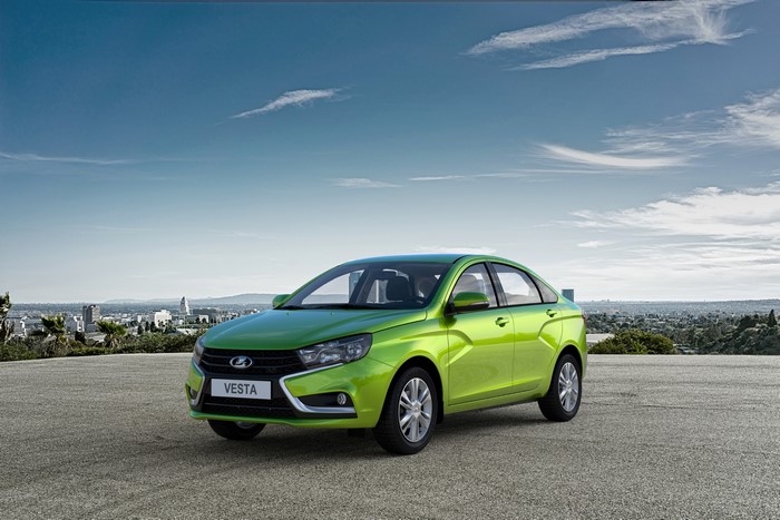 4K Lada Vesta sedan in yellow-green metallic