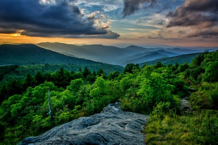 Mountain range at sunset with dramatic clouds