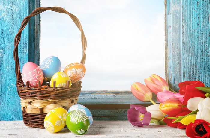Easter Eggs in Wicker Basket with Tulips