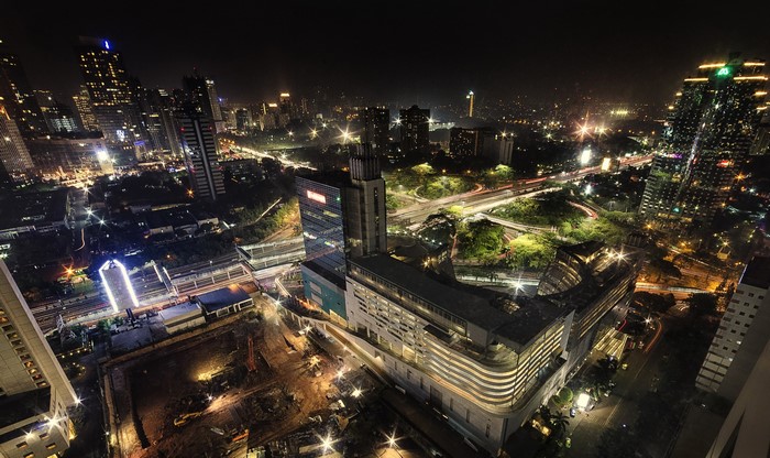 Night view of Jakarta cityscape with roads and buildings