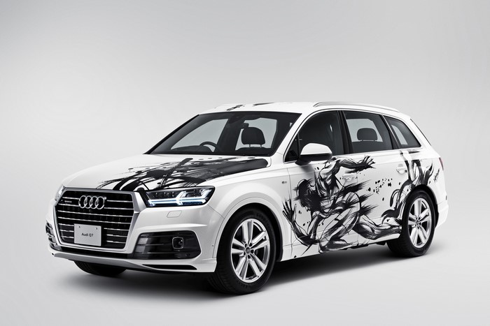 White Audi Q7 with black ink art