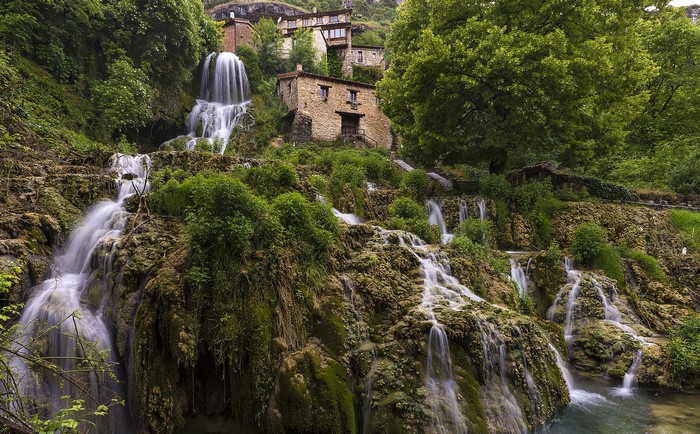 Orbaneja del Castillo waterfalls and houses in Spain