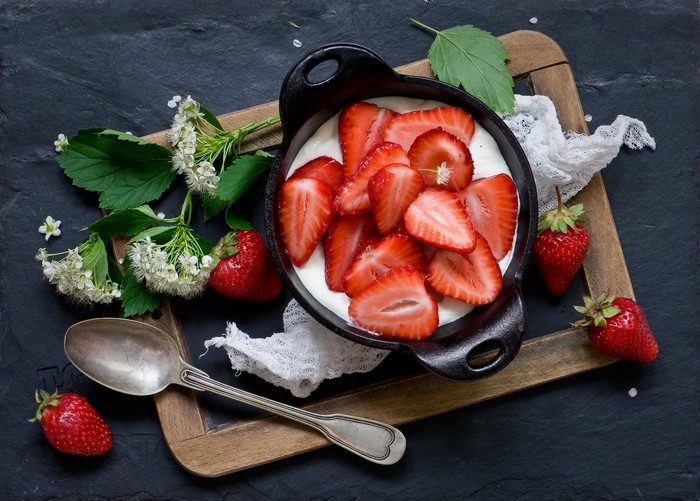 Strawberries and cream with spoon