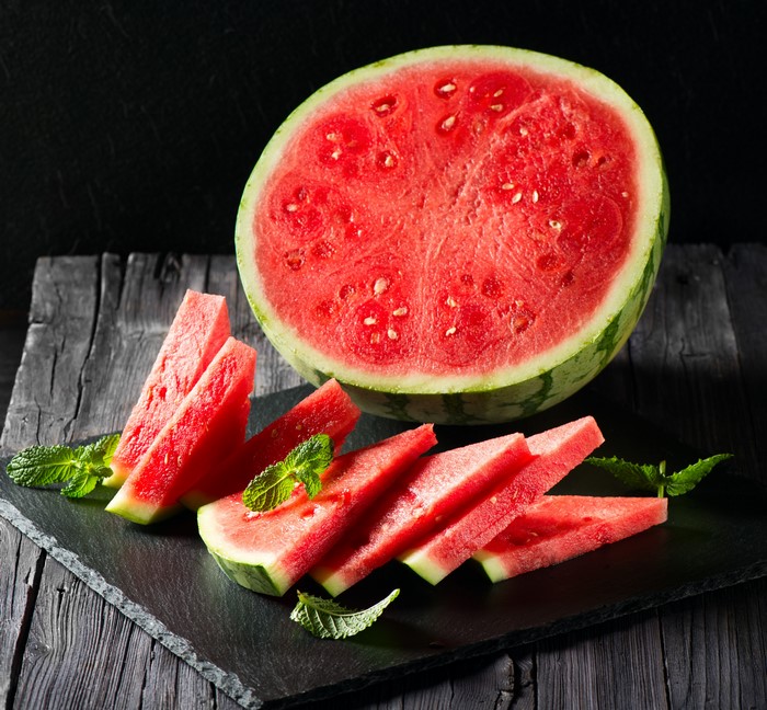 Watermelon slices and half watermelon