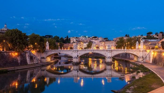 Ponte Sant'Angelo bridge over Tiber River in Rome at night