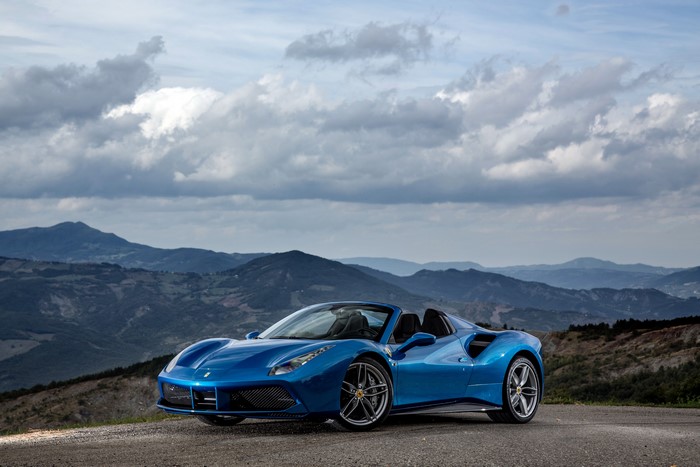 Blue Ferrari 488 Spider Cabriolet in Mountains