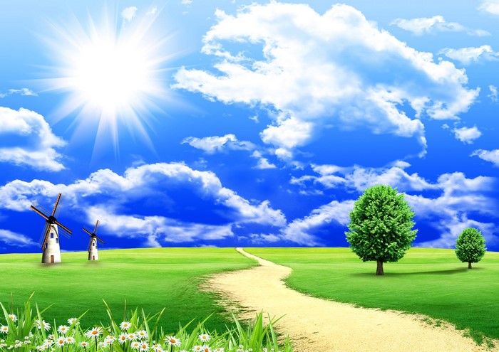 Sunny day with windmills and trees in a field