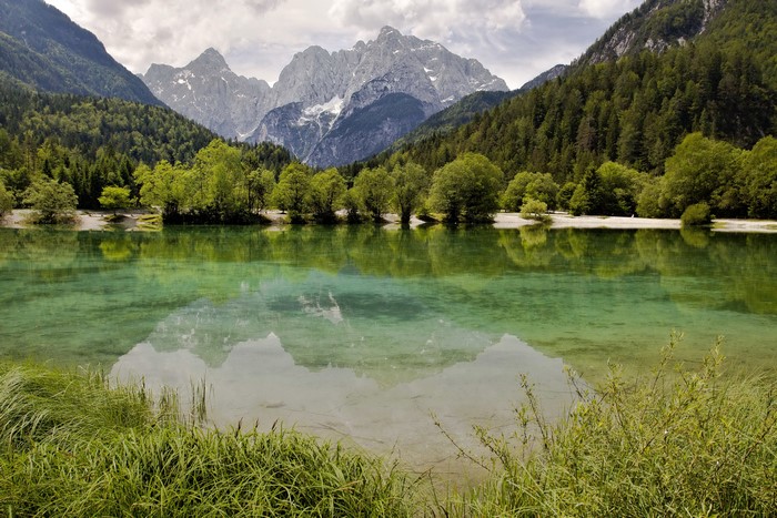 Lake Jasna in Slovenia with Mountains and Forests