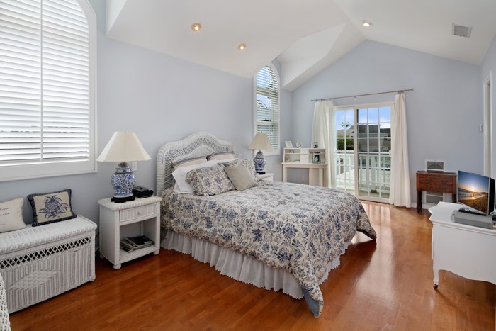 Bedroom with Wicker Furniture and Blue Floral Bedding