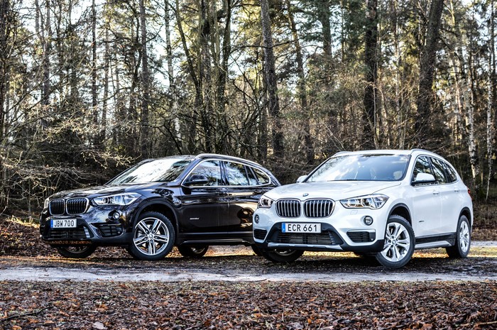 Two BMW X1 cars in a forest