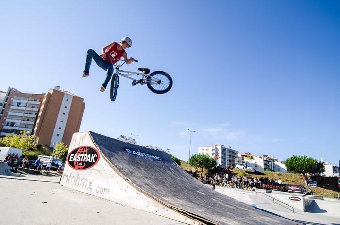BMX rider performing a jump at Eastpak event