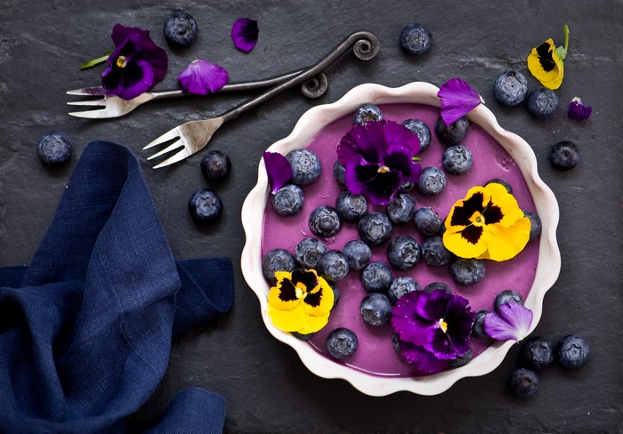 Blueberry dessert with pansies and forks