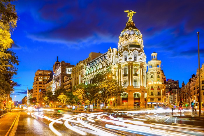 Madrid street at night with light trails
