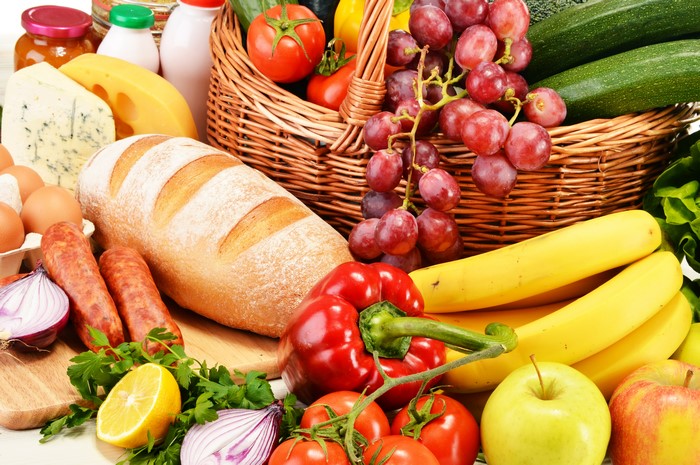 Assortment of Fresh Bread, Fruits, Vegetables, and Sausages