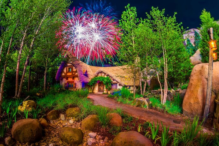 Snow White's Cottage with Fireworks at Night