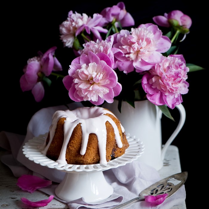 Bundt cake with pink icing and peonies
