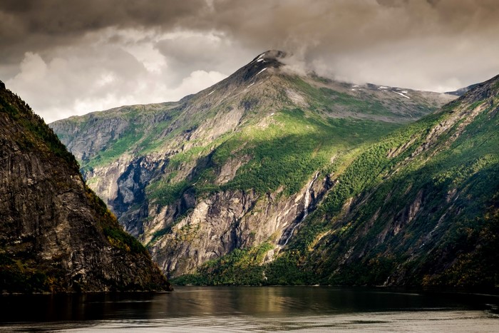 Mountains and a lake under a cloudy sky