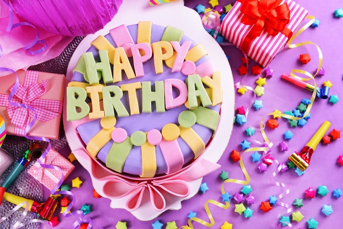 Birthday Cake with "Happy Birthday" Text and Gifts