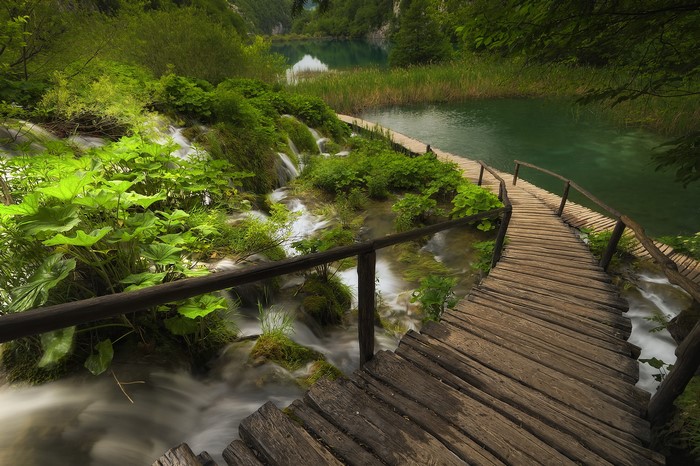 Wooden boardwalk over waterfalls at Plitvice Lakes National Park, Croatia