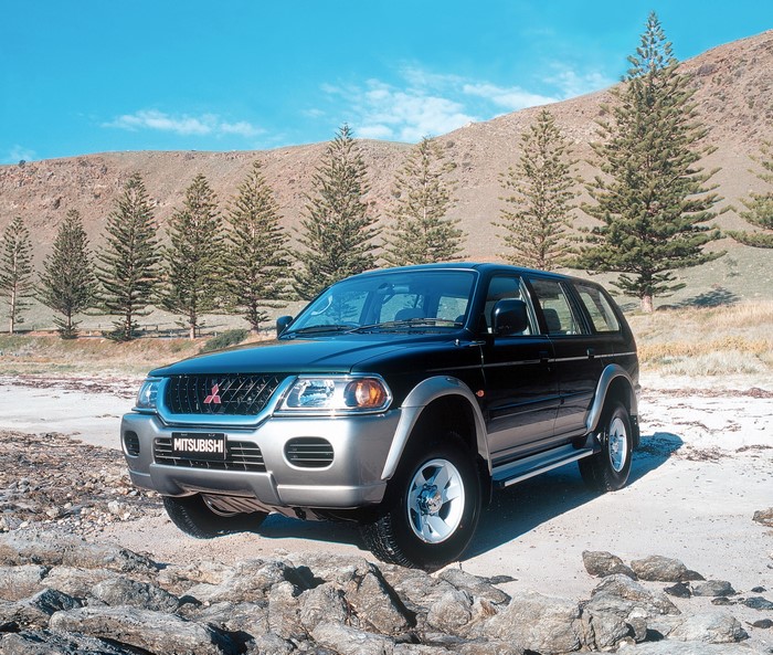 Mitsubishi Challenger parked on a rocky beach