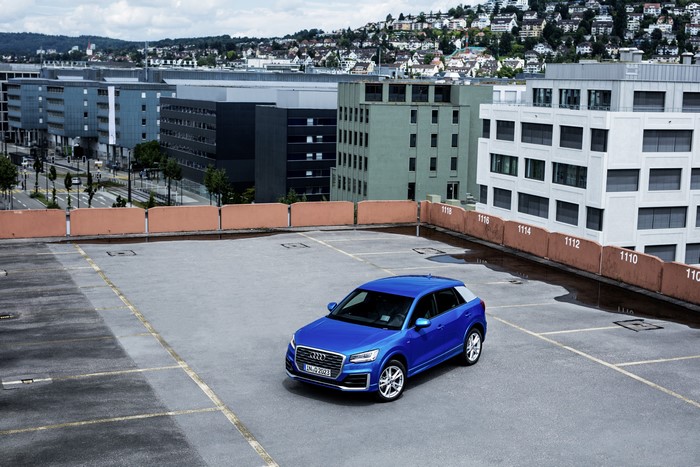 Blue Audi Q2 TDI quattro S parked on rooftop