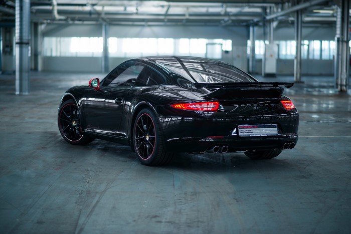 Black Porsche 911 Carrera Coupe from behind
