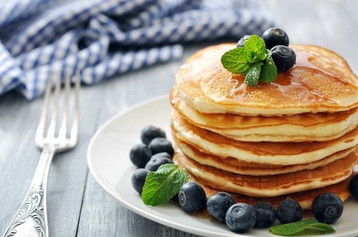 Stack of Pancakes with Blueberries and Fork