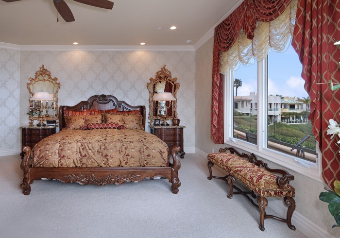 Luxury Bedroom with Ornate Furniture and Ocean View