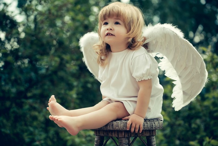 Little girl with angel wings