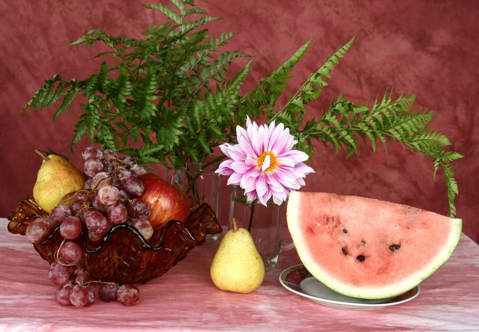 Still-life with fruits and a dahlia flower
