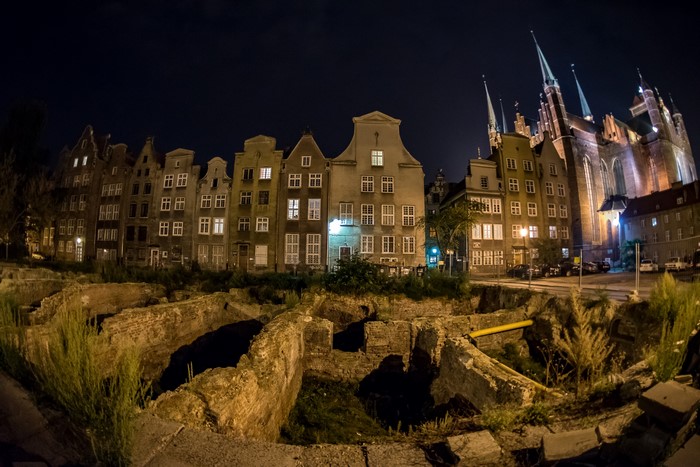 Ruins and historic buildings at night in Gdansk, Poland