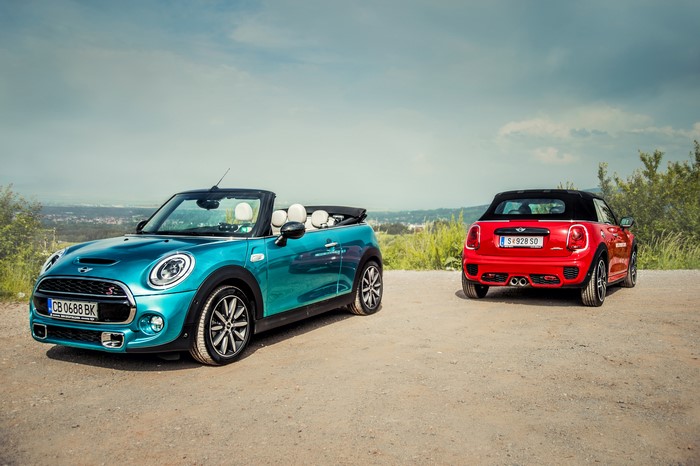 Two Mini Cabriolets on a dirt road