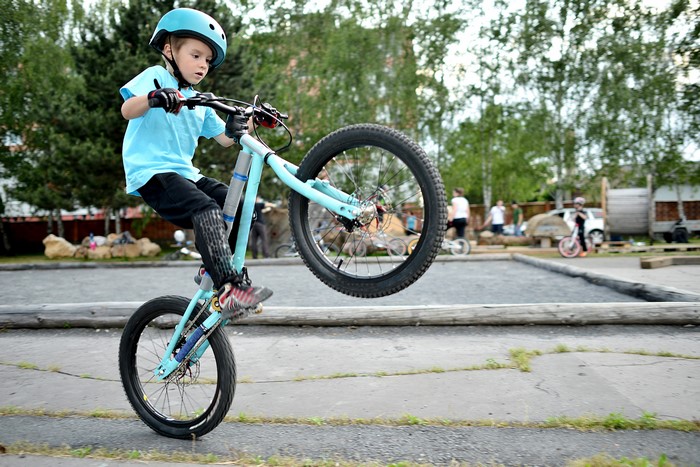 Boy on Bicycle Wearing Helmet