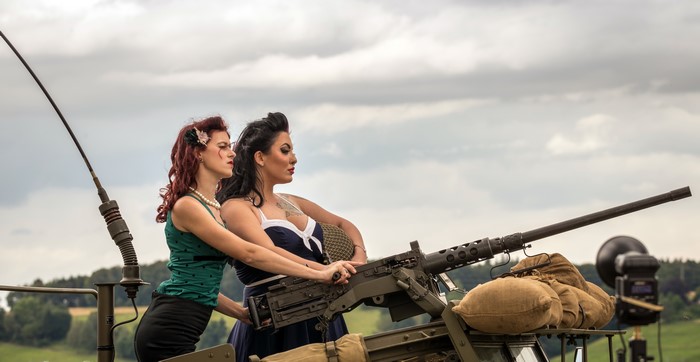 Two women with a machine gun