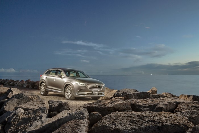 Mazda CX-9 Azami on rocky shore at dusk