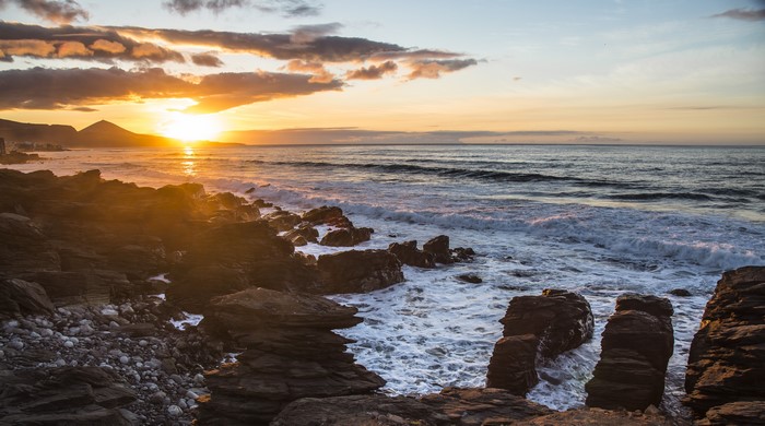 Sunset over the rocky coast of Gran Canaria, Spain