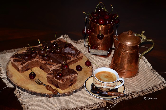 Chocolate cake with cherries and coffee
