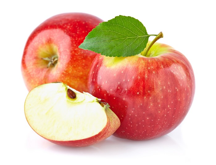 Apples with a leaf and slice on white background