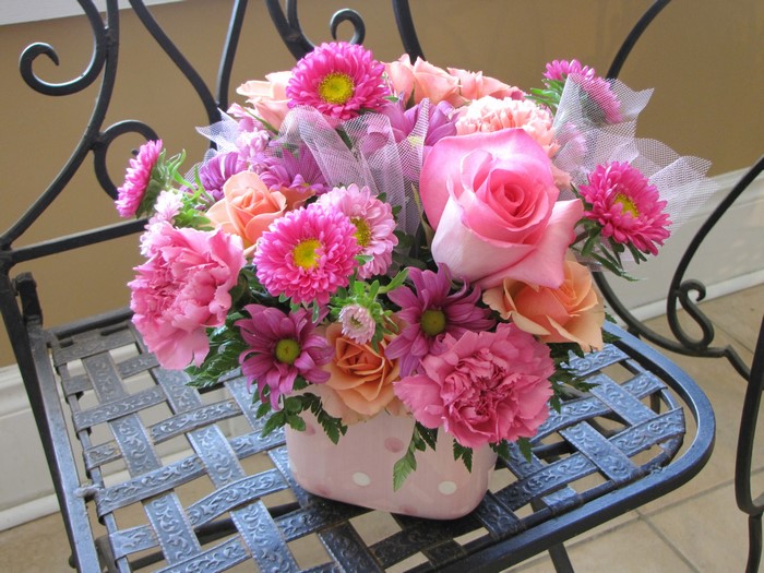 Pink and orange flower bouquet with roses and asters