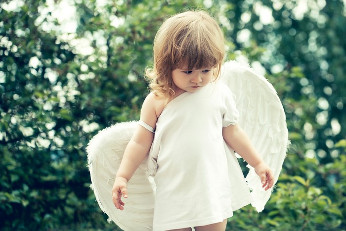Little girl with angel wings