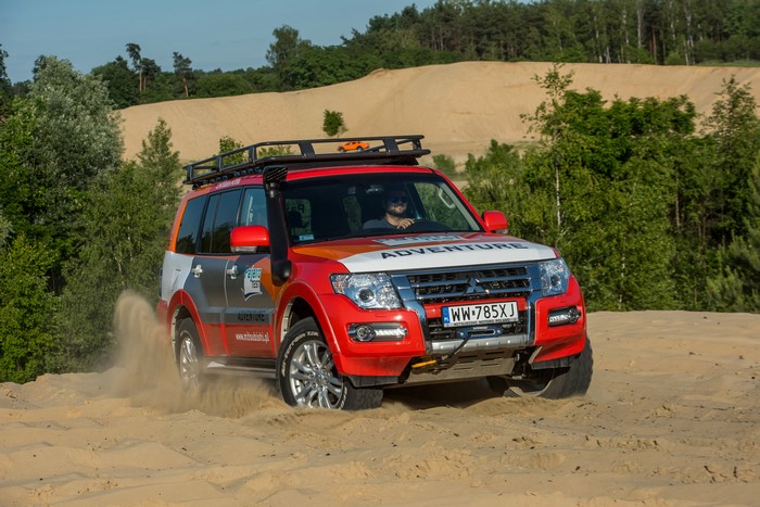 Mitsubishi Pajero Adventure driving on sand dunes