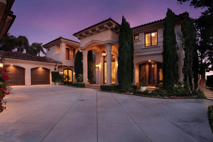 Luxury Mansion with Garage at Dusk
