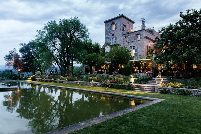 Chateau de la Colle Noire with pond and garden at dusk