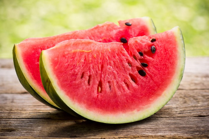 Watermelon slices on a wooden table