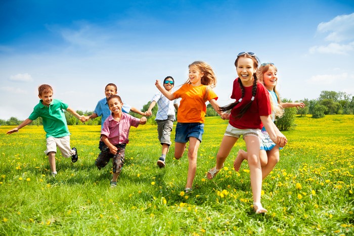 Children Running in a Field of Yellow Flowers