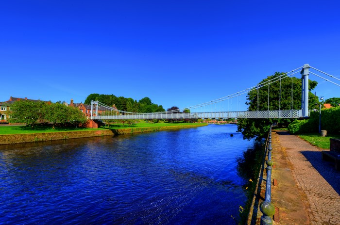 Suspension bridge over a river in Dumfriesshire, Scotland