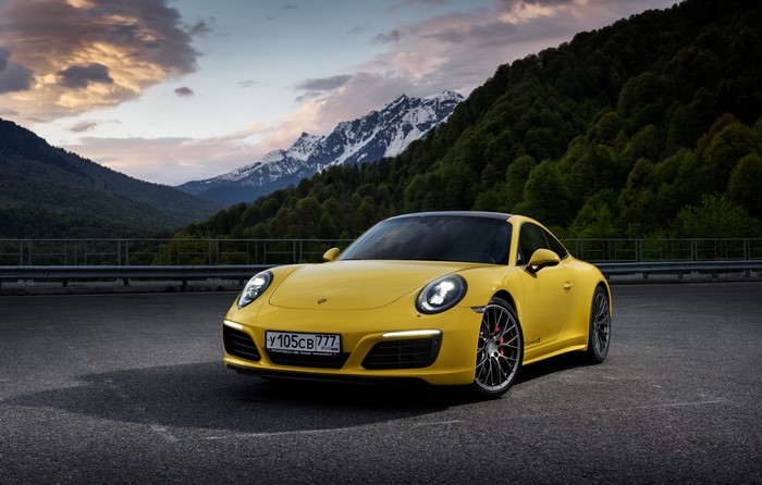 Yellow Porsche 911 Carrera 4S Coupe in Mountains