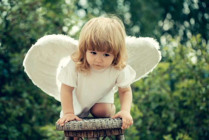 Little girl with angel wings