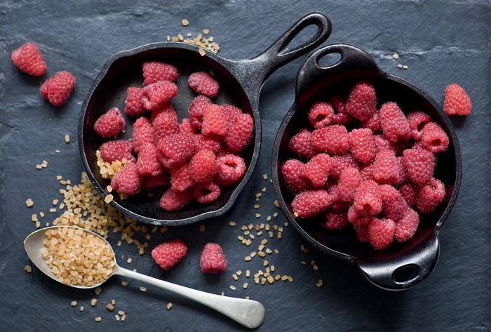 Raspberries and brown sugar in cast iron pans