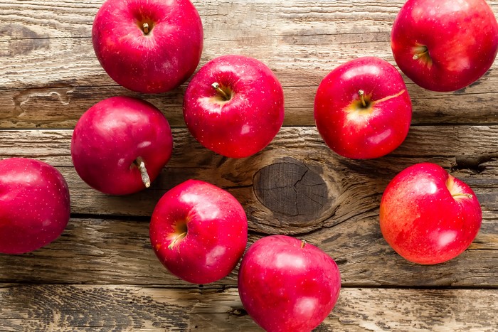 Red Apples on Wooden Table